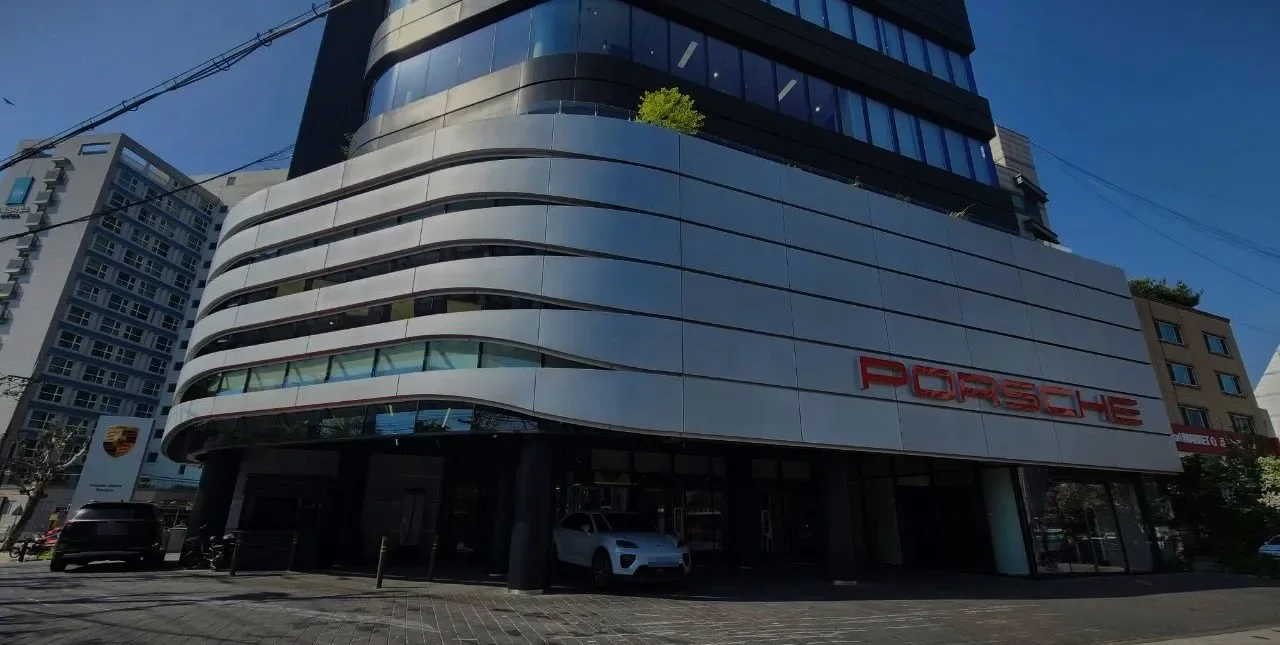 A car brand showroom building with a curved facade